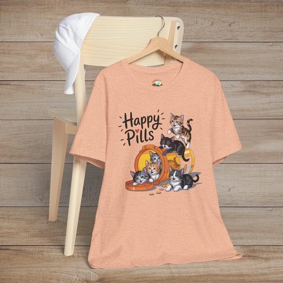Happy Pills kitten t-shirt on heather peach fabric with cute cartoon kittens playing around an orange pill bottle