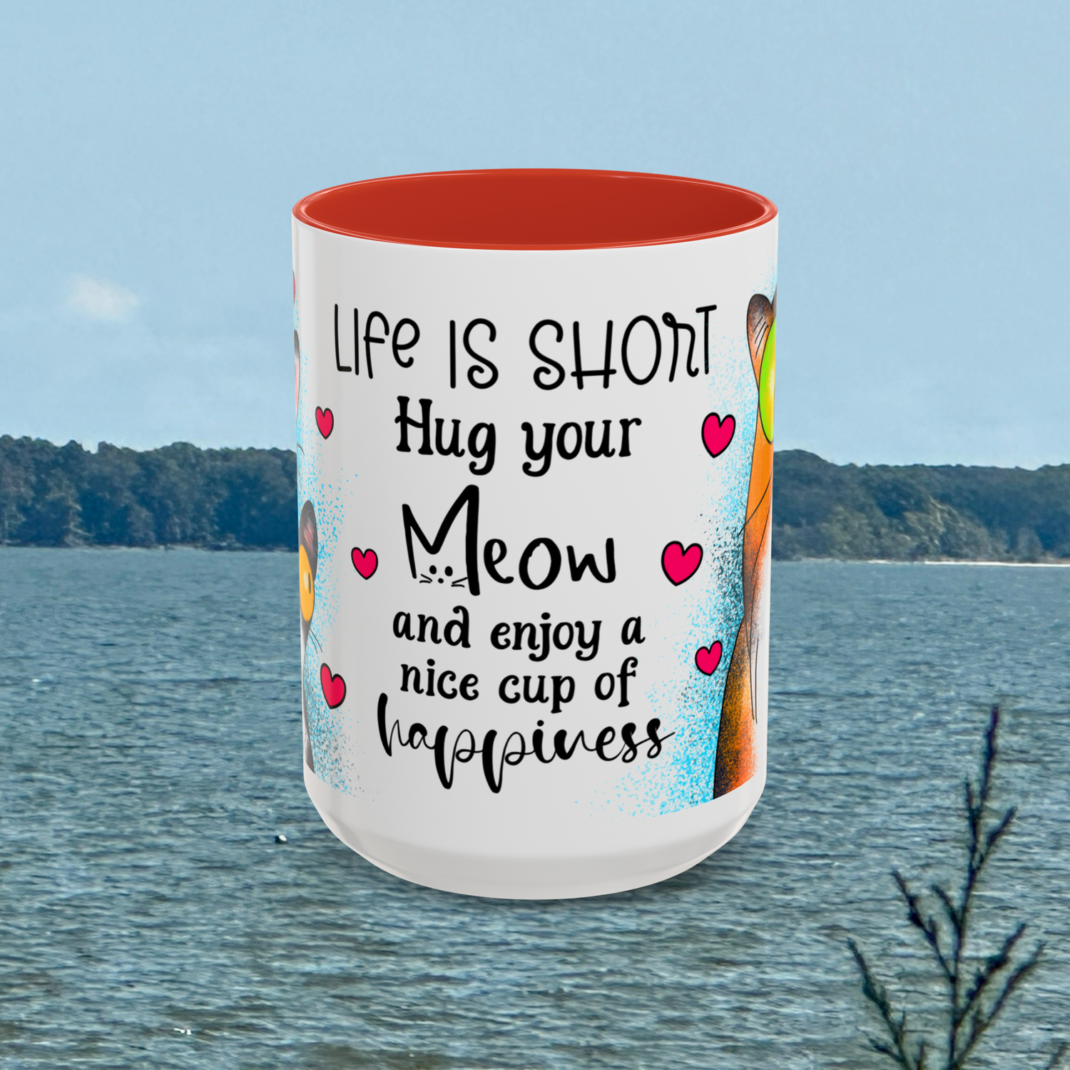 Front view of the 15 oz Hug Your Meow Mug with bold red interior, showcasing the heartwarming and funny phrase 'Life is short, Hug your Meow and enjoy a nice cup of happiness,' decorated with pink hearts and cartoon cat peeking from the side. Perfect for fun feline fans