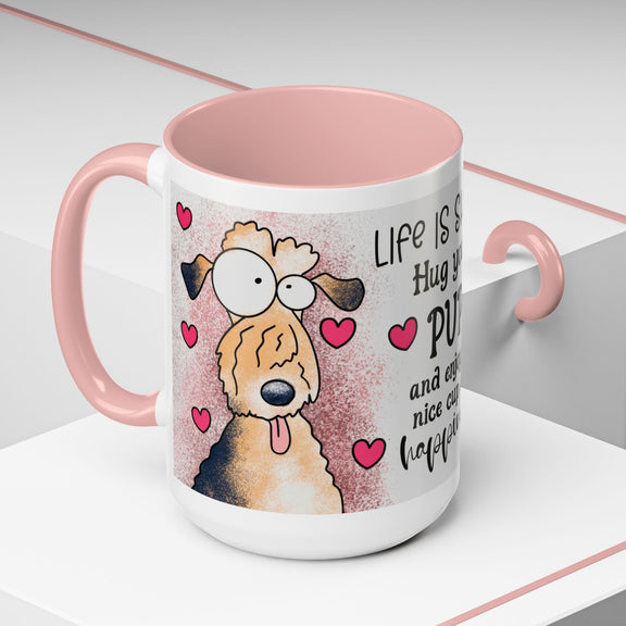 Left-side view of the 15 oz Hug Your Pup Mug, decorated with charming dog cartoon art, lovely pink interior, handle, and playful hearts. Includes the uplifting message 'Life is short, Hug your PUP and enjoy a nice cup of happiness.' Ideal for dog lovers