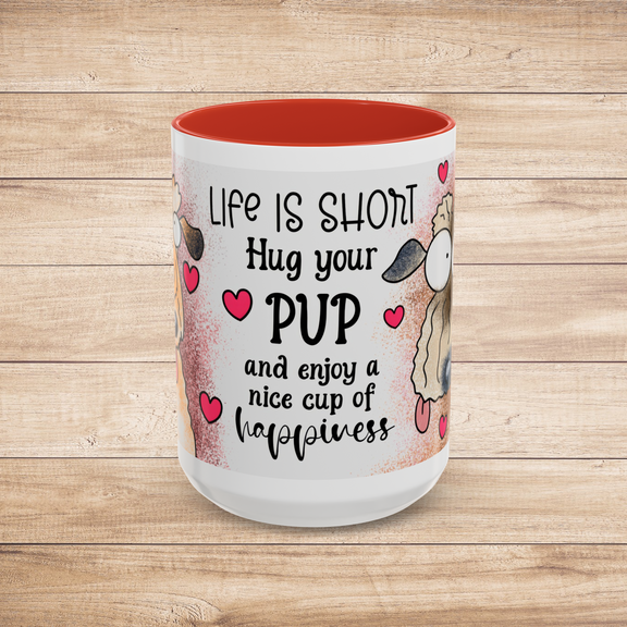 Front view of the larger 15 oz Hug Your Pup Mug featuring cheerful dog-themed artwork and the delightful phrase 'Life is short, Hug your PUP and enjoy a nice cup of happiness.' Enhanced with red trim and adorable hearts, perfect for coffee or tea lovers who cherish their dogs