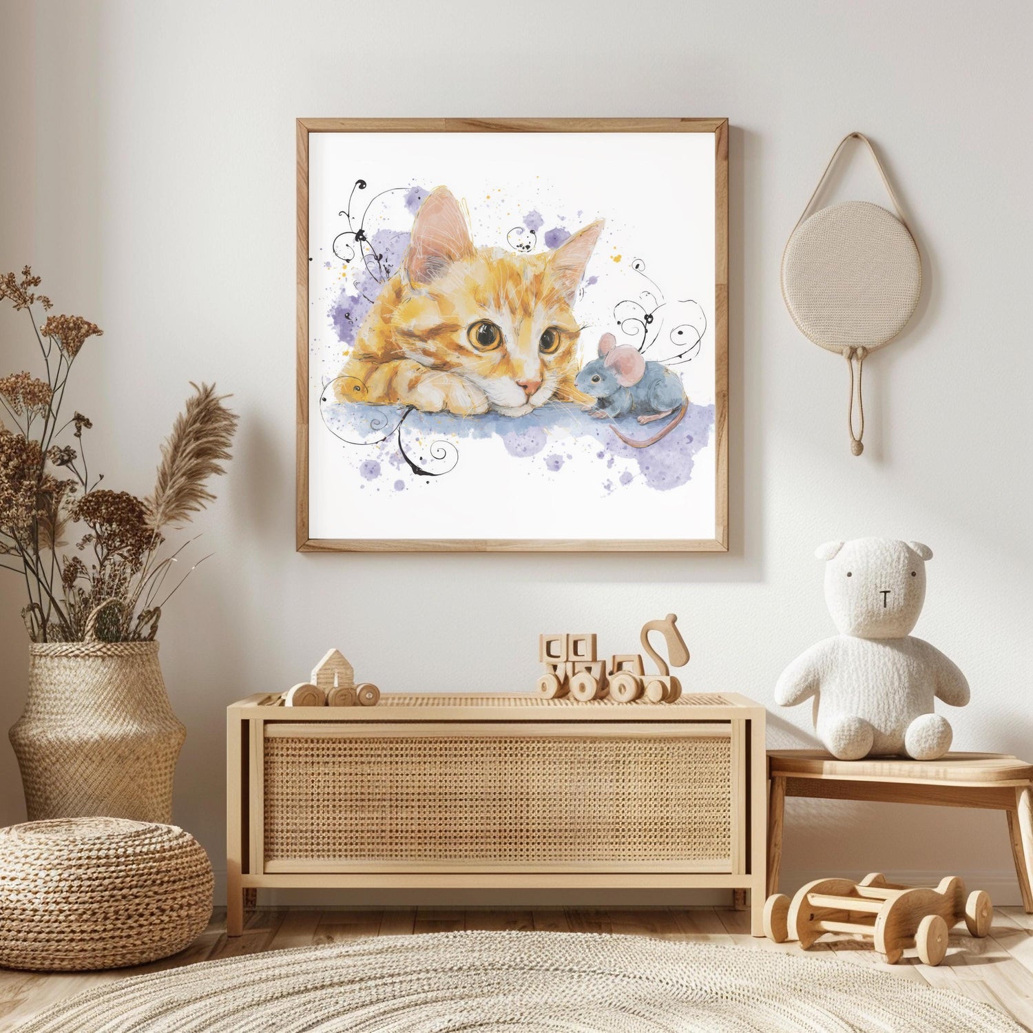 May include: A framed watercolor print of a ginger cat and a gray mouse. The cat is looking at the mouse with a curious expression. The background features purple watercolor splashes and black swirls. The frame is made of light-colored wood.