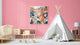 May include: A children's room with a pink wall, a framed lion artwork, and a white teepee. The room also features a crib, a small table, and a low cabinet. A white rug covers the floor.