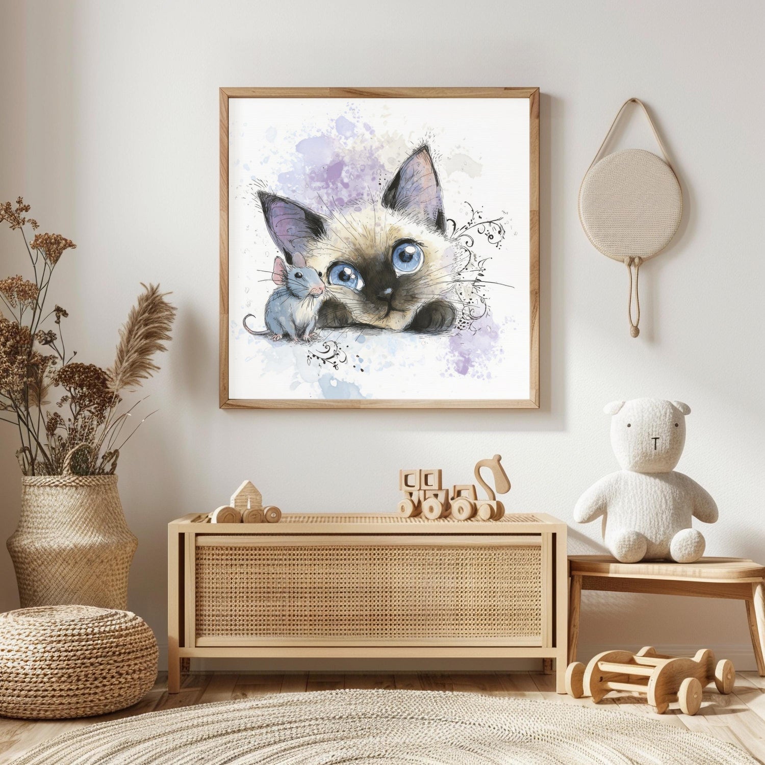May include: A framed watercolor print of a Siamese cat and a mouse. The cat has blue eyes and is looking at the mouse. The print is in a wooden frame and hangs on a white wall. The room has a neutral color palette.