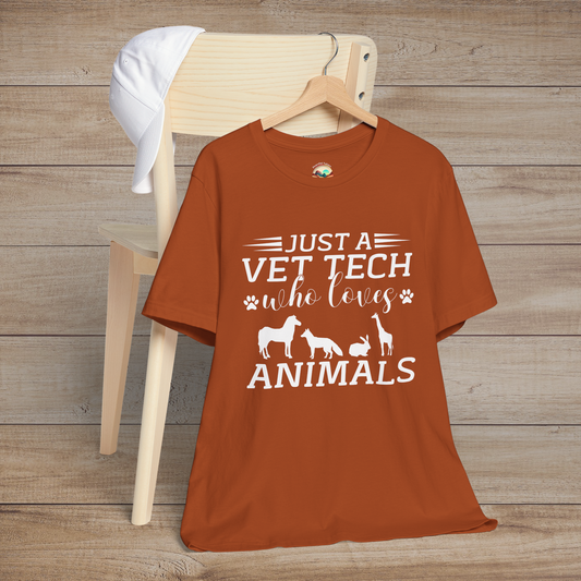 Autumn-colored t-shirt showing the phrase Just a Vet Tech Who Loves Animals surrounded by farm and wildlife animal silhouettes in white