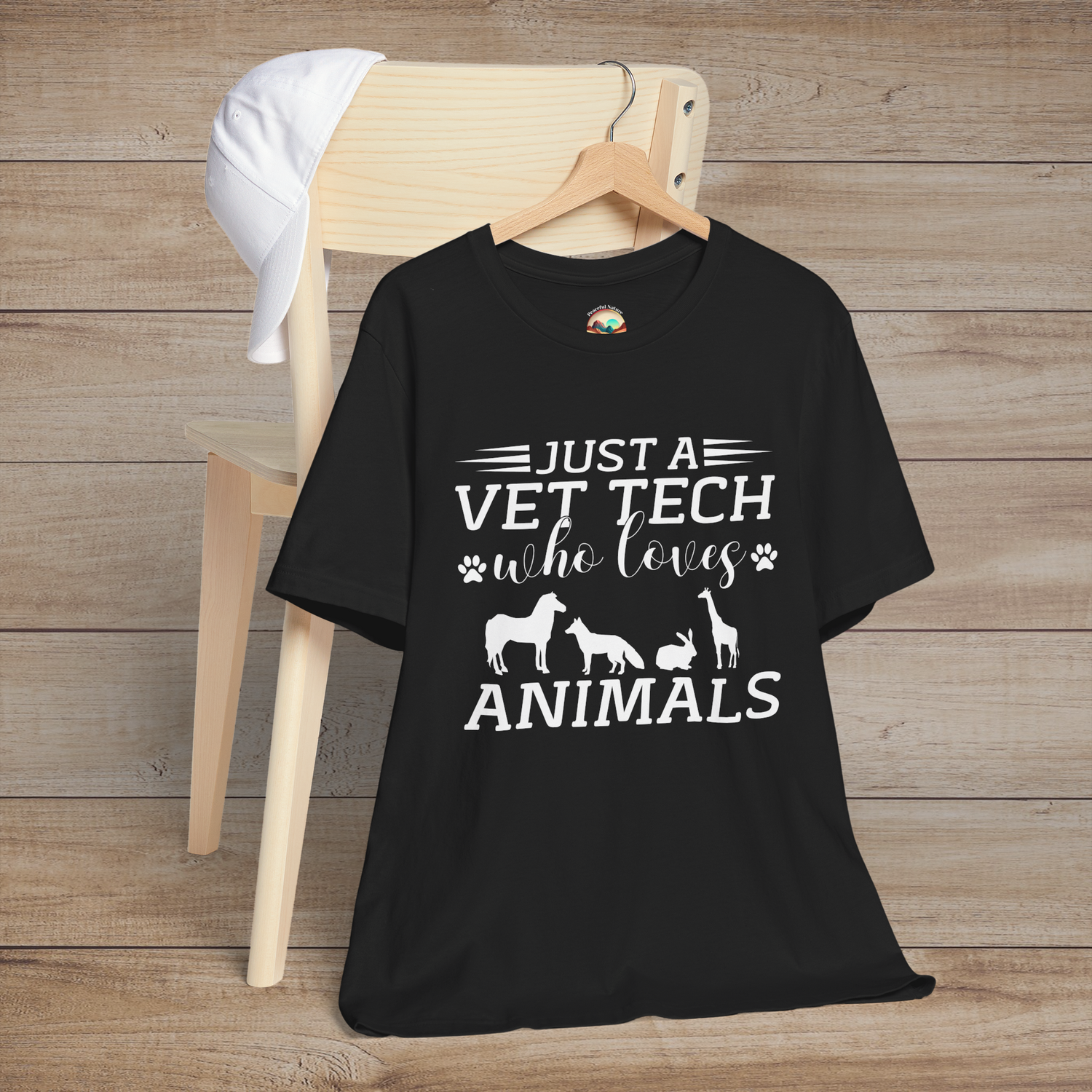 Black t-shirt featuring white text that reads Just a Vet Tech Who Loves Animals with silhouettes of a horse, fox, rabbit, and giraffe