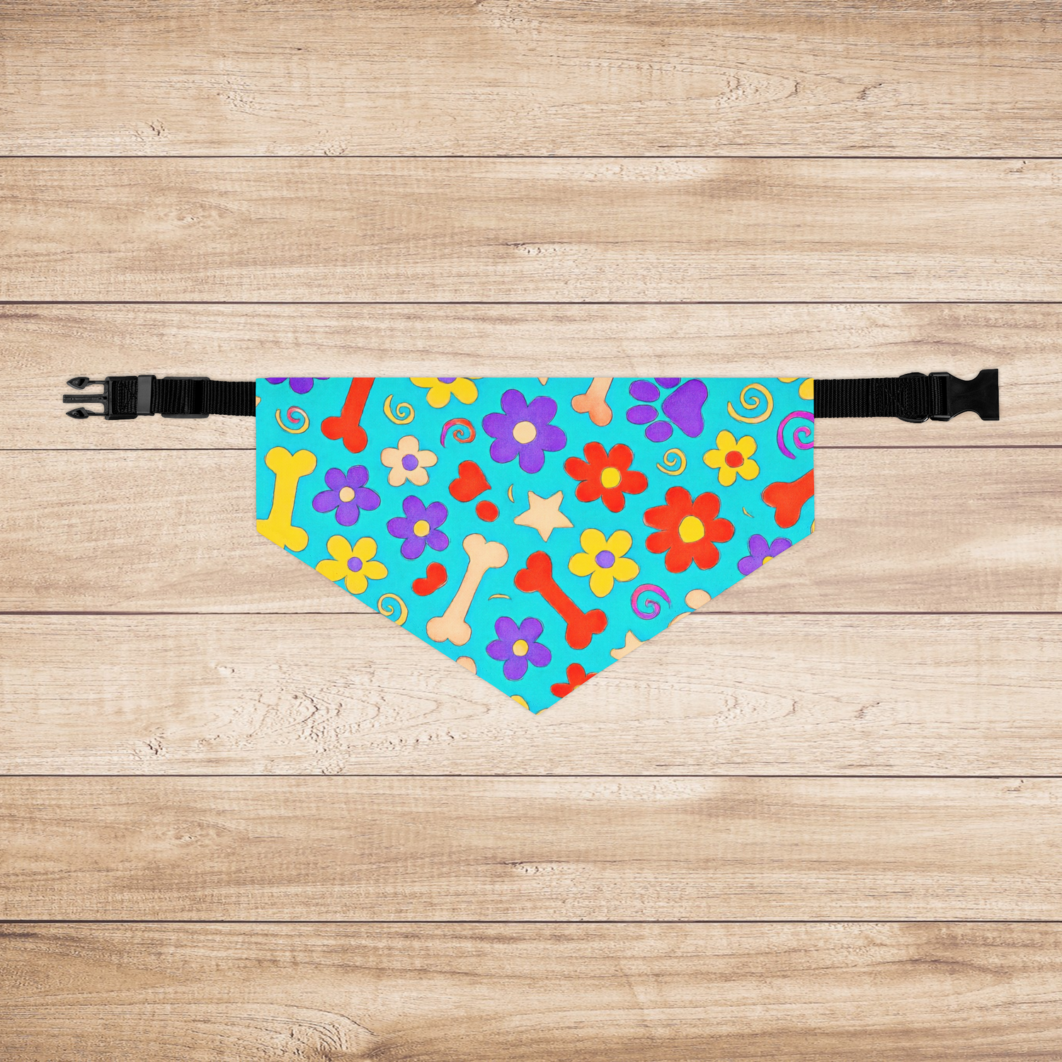 Flat-lay of large dog bandana with vivid bone and flower pattern