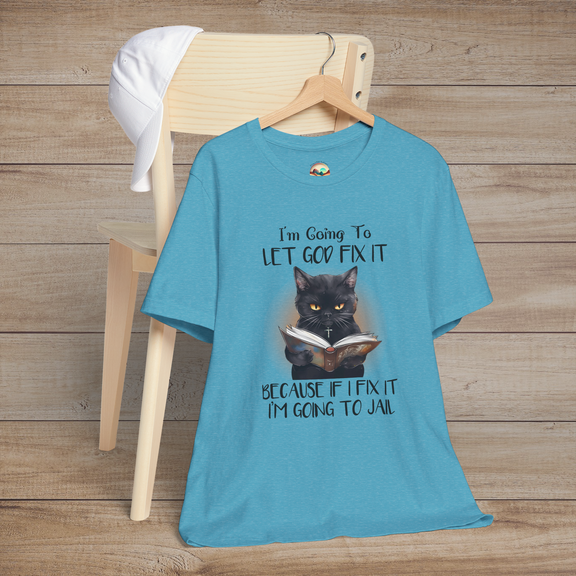 Heather aqua Let God Fix It T-Shirt showing a black cat wearing a cross and reading a book with funny religious humor