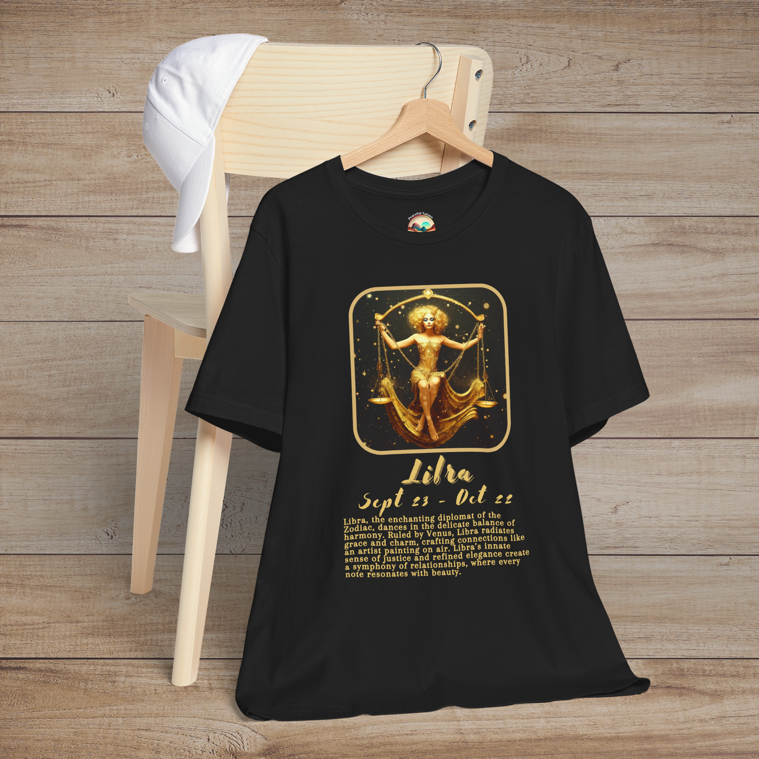 Black Libra Zodiac T-Shirt with a gold scales symbol, birth dates, and traits of harmony and balance