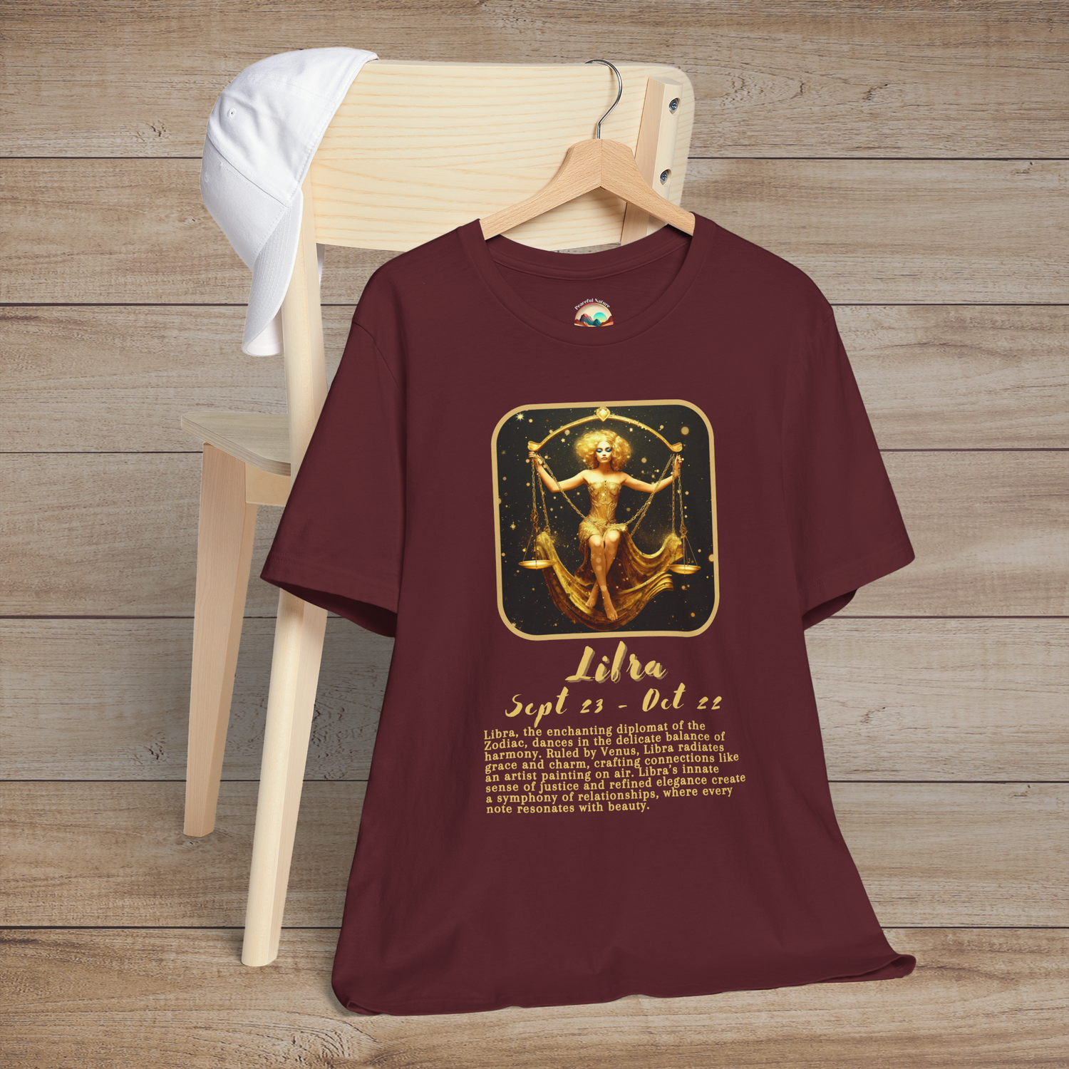 Maroon Libra Zodiac T-Shirt featuring a radiant golden scales symbol and diplomatic astrology traits
