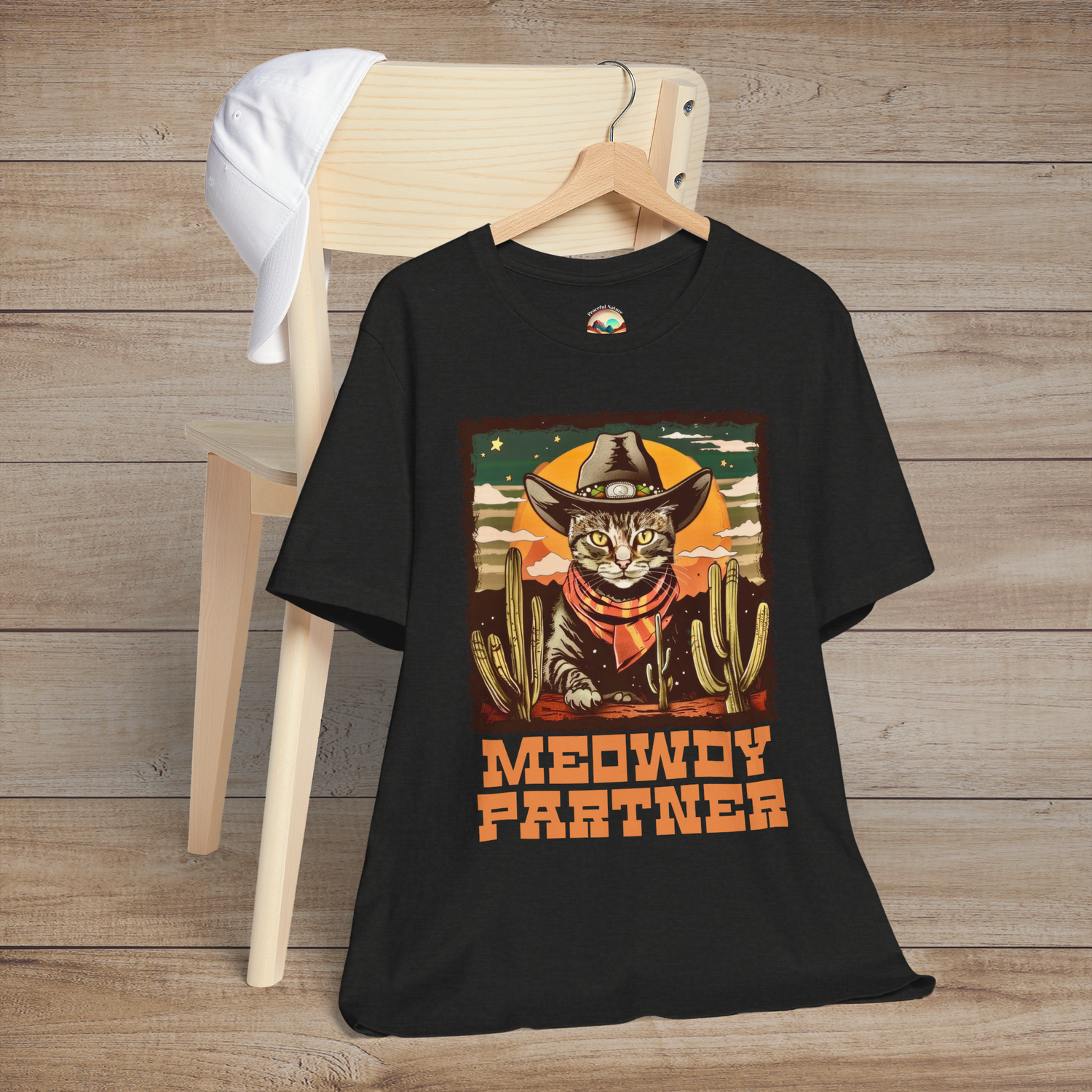 Meowdy Partner Funny Cowboy Cat T-Shirt in Black Heather, featuring a charming cat wearing a cowboy hat and neckerchief, with cacti and vintage Western style