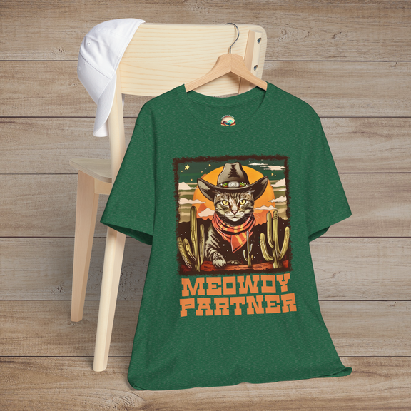 Heather Green Grass Meowdy Partner Funny Western Cat T-Shirt, displaying an adorable cowboy cat in hat and neckerchief amidst cacti scenery
