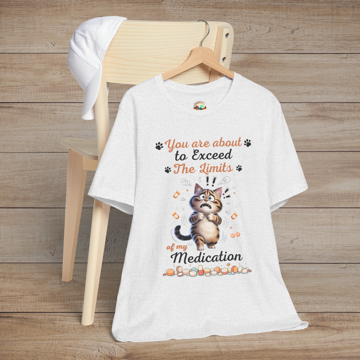 Funny ash white t-shirt with a cat graphic and text on a wooden background