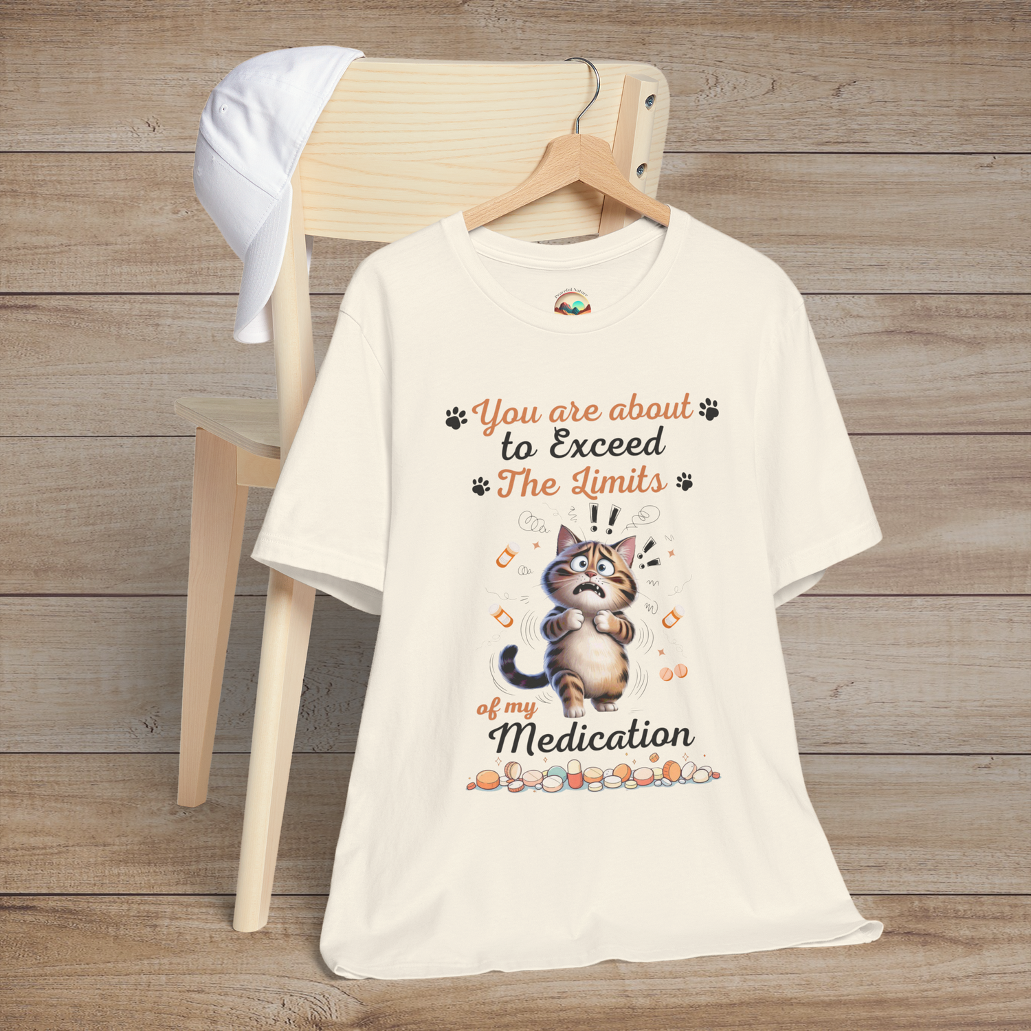 Funny natural white t-shirt with a cat graphic and text on a wooden background