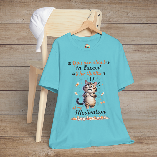 Funny turquoise t-shirt with a cat graphic and text on a wooden background