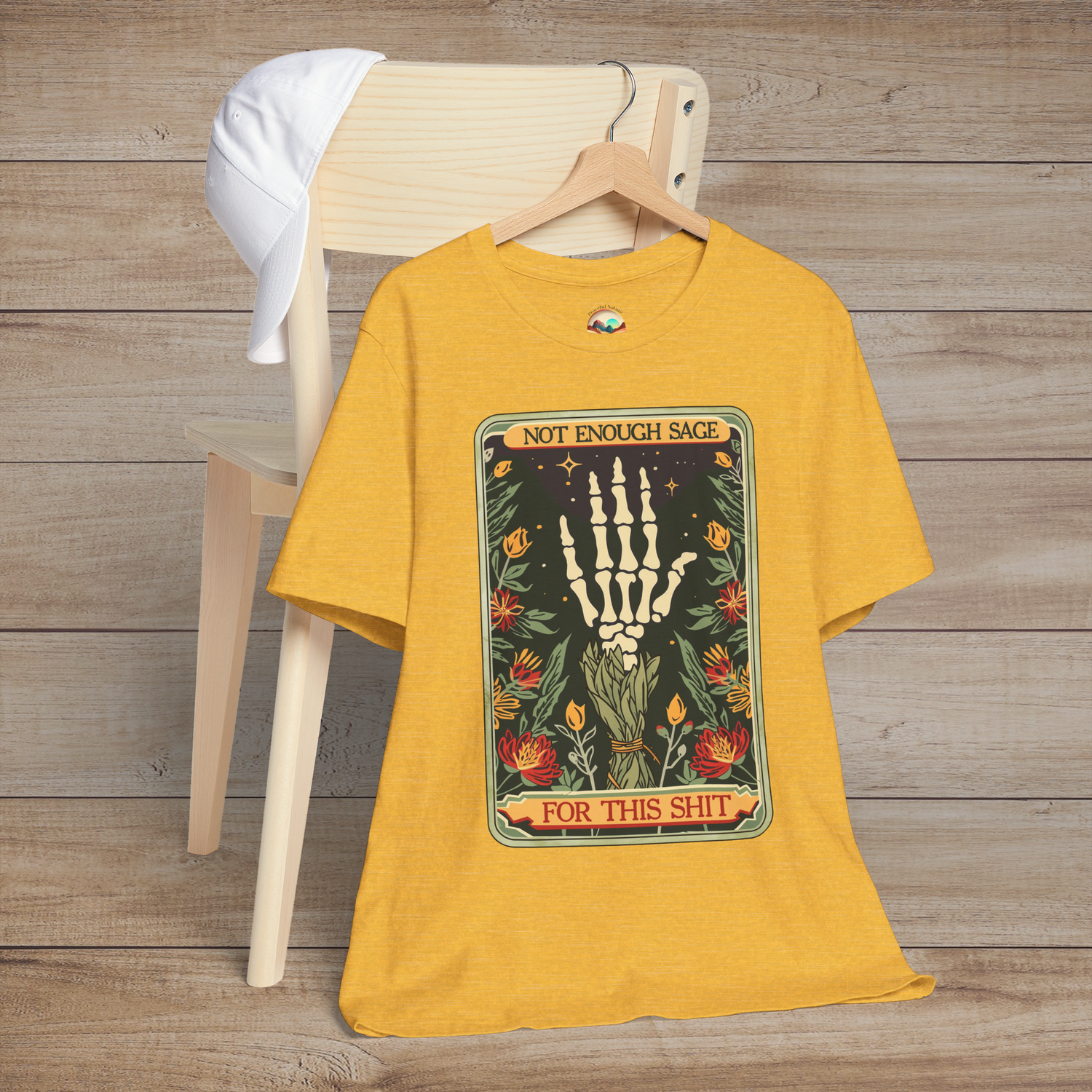 Heather Yellow Gold Not Enough Sage for This Sh*t T-Shirt featuring a boho-goth inspired skeleton hand and sage floral design