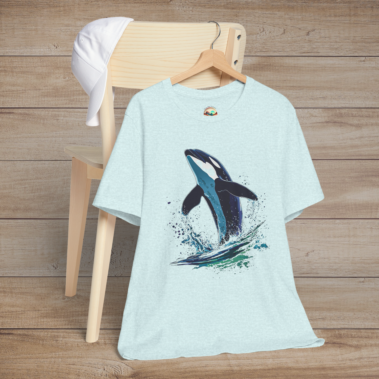 Ice blue heather Bella+Canvas tee with bold orca splash graphic