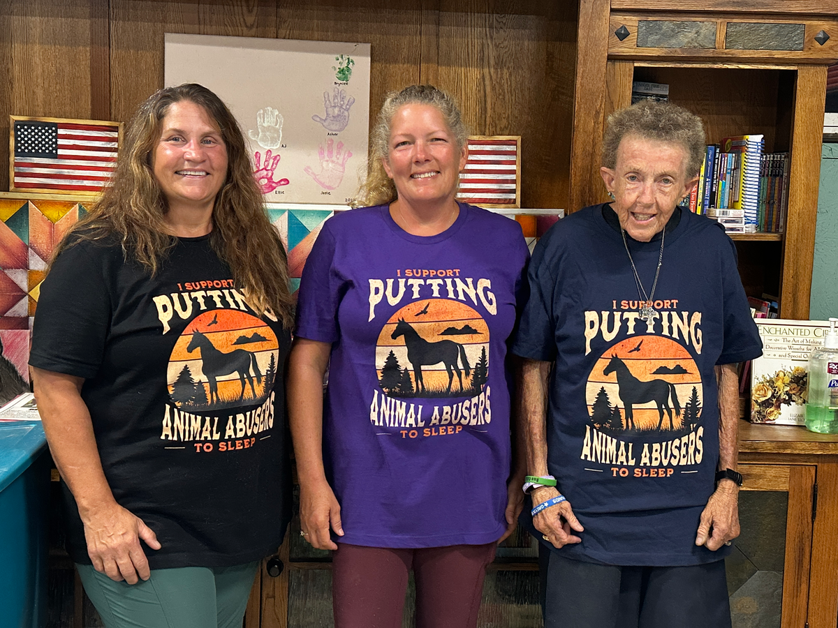 Staff and volunteers of Valor Ranch, Virginia, sport their Sunset Justice t-shirts, each wearing a different color shirt.