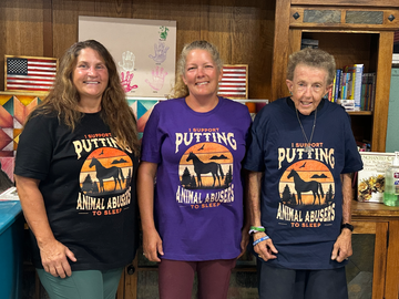 Staff and volunteers of Valor Ranch, Virginia, sport their Sunset Justice t-shirts, each wearing a different color shirt.
