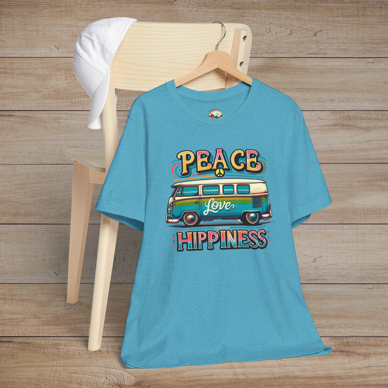 Heather aqua unisex t-shirt featuring a colorful retro van design with the words "Peace Love Hippiness"