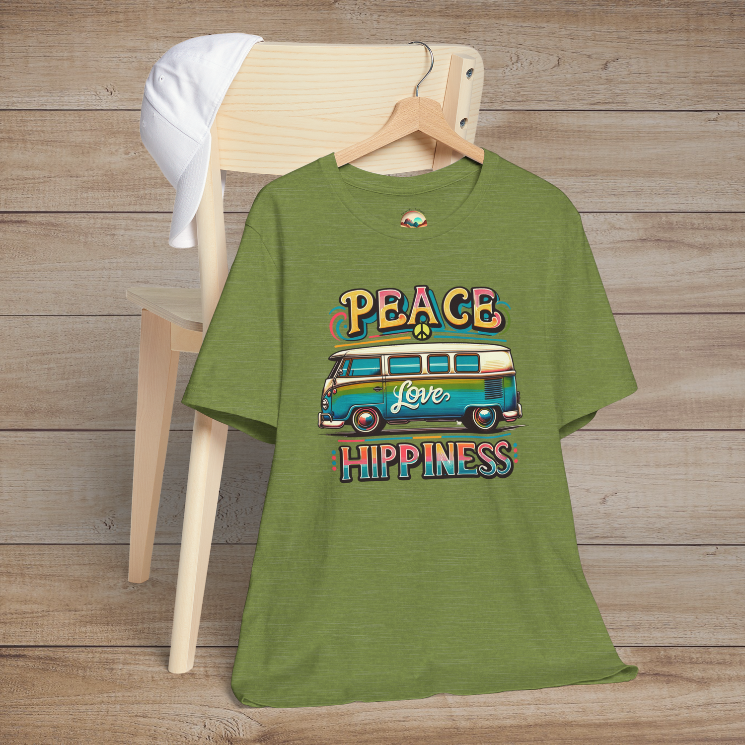 Heather green unisex t-shirt featuring a colorful retro van design with the words "Peace Love Hippiness"