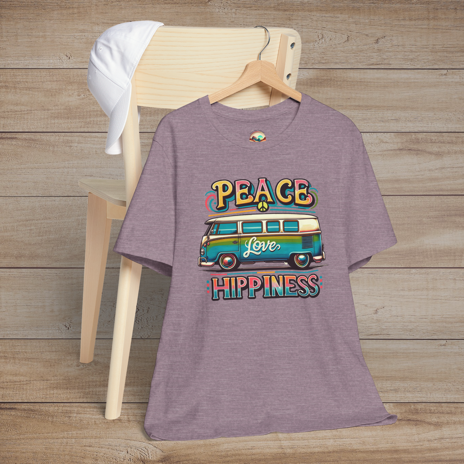 Heather purple unisex t-shirt featuring a colorful retro van design with the words "Peace Love Hippiness"