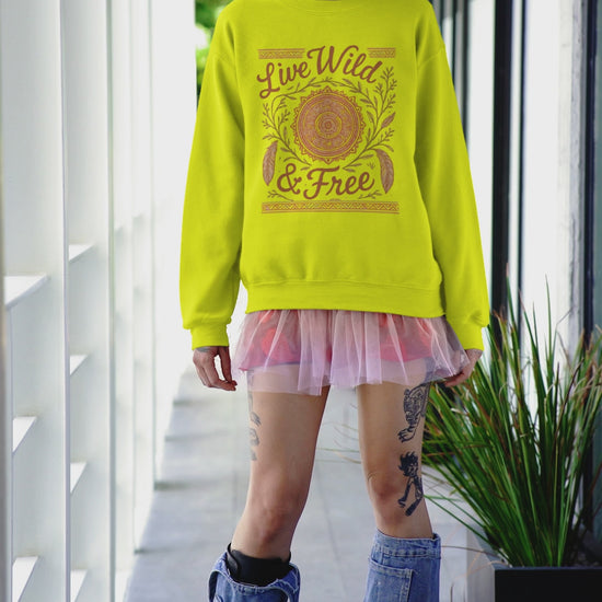 Video of a model in a Harajuku-inspired outfit wearing the Live Wild & Free boho mandala sweatshirt