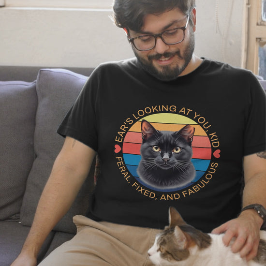 Video of man wearing black Ear’s Looking at You Kid TNR cat shirt with retro ear-tipped black cat design, Bella Canvas 3001