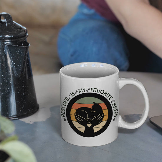 Video of woman pouring beverage in Rescued Is My Favorite Breed Cat Rescue Mug.