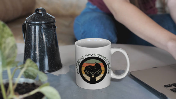 Video of woman pouring beverage in Rescued Is My Favorite Breed Cat Rescue Mug.