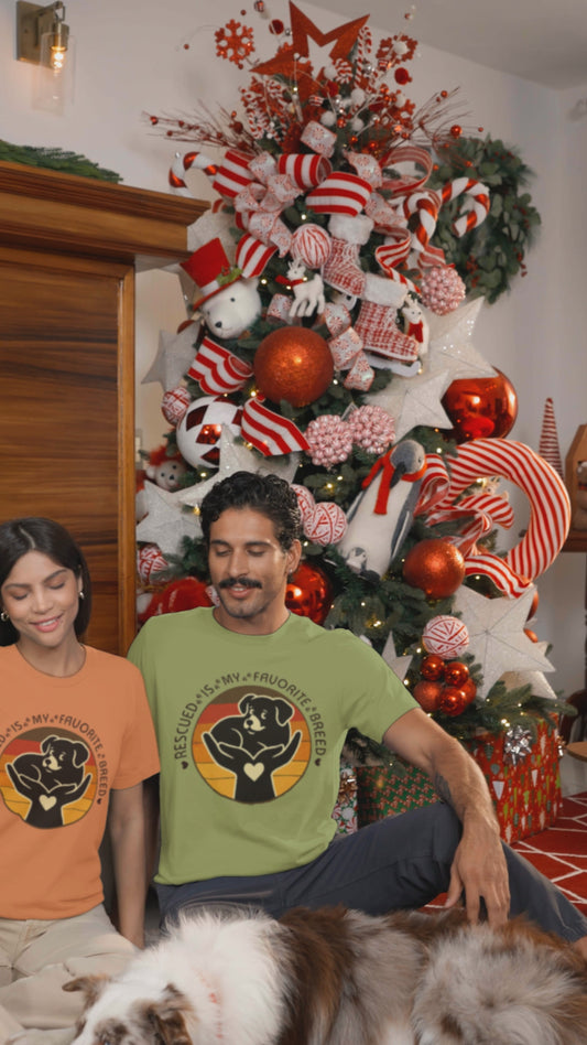 Video Rescued Is My Favorite Breed Puppy Tee worn by models in burnt orange and heather green at Christmas time.