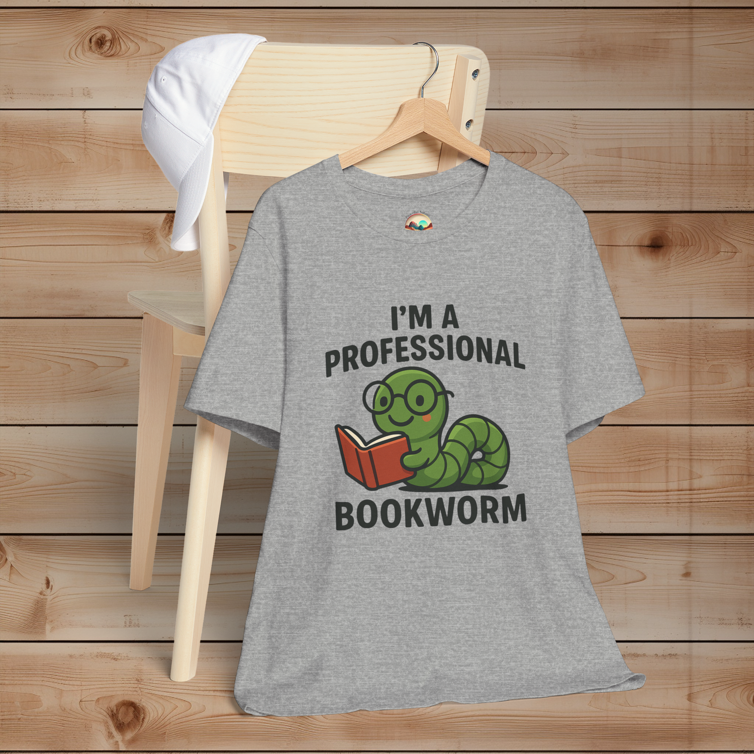 Gray t-shirt with 'I'm a Professional Bookworm' design on a wooden background