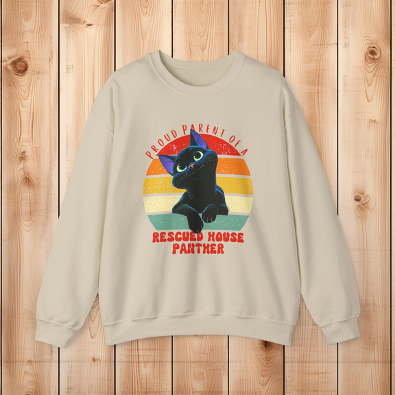 Sand color Gildan 18000 sweatshirt displaying a rescued black cat house panther vintage design