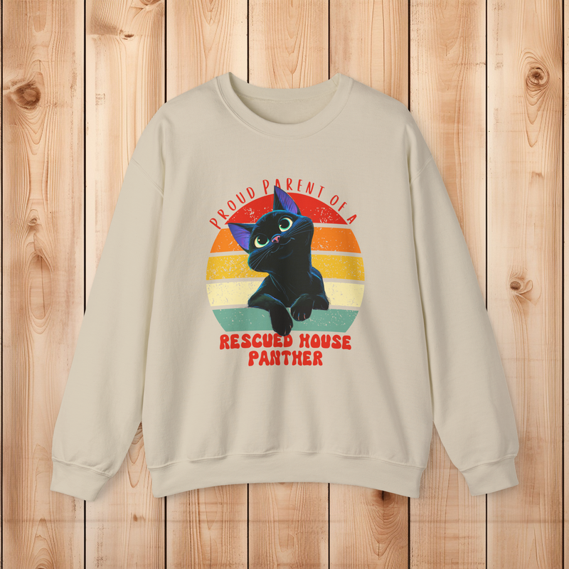 Sand color Gildan 18000 sweatshirt displaying a rescued black cat house panther vintage design