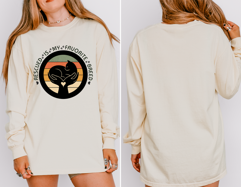 Ivory-colored long-sleeve Comfort Colors 6014 shirt, seen on model, with retro rescued cat design saying Rescued Is My Favorite Breed
