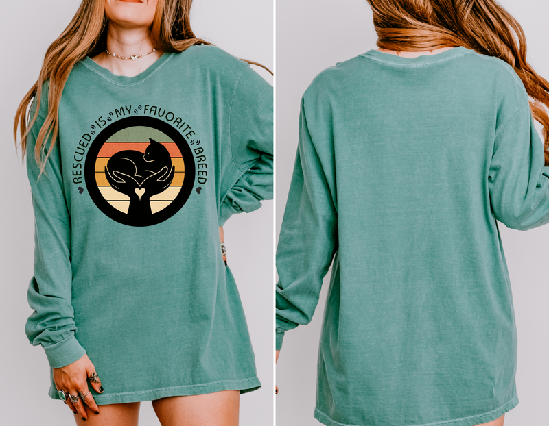 Light green long-sleeve Comfort Colors 6014 shirt, seen on model, with retro rescued cat design saying Rescued Is My Favorite Breed