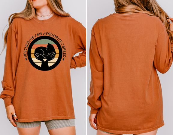 Yam-colored long-sleeve Comfort Colors 6014 shirt, seen on model, with retro rescued cat design saying Rescued Is My Favorite Breed
