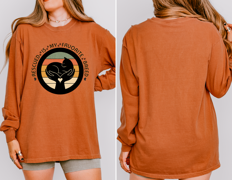 Yam-colored long-sleeve Comfort Colors 6014 shirt, seen on model, with retro rescued cat design saying Rescued Is My Favorite Breed