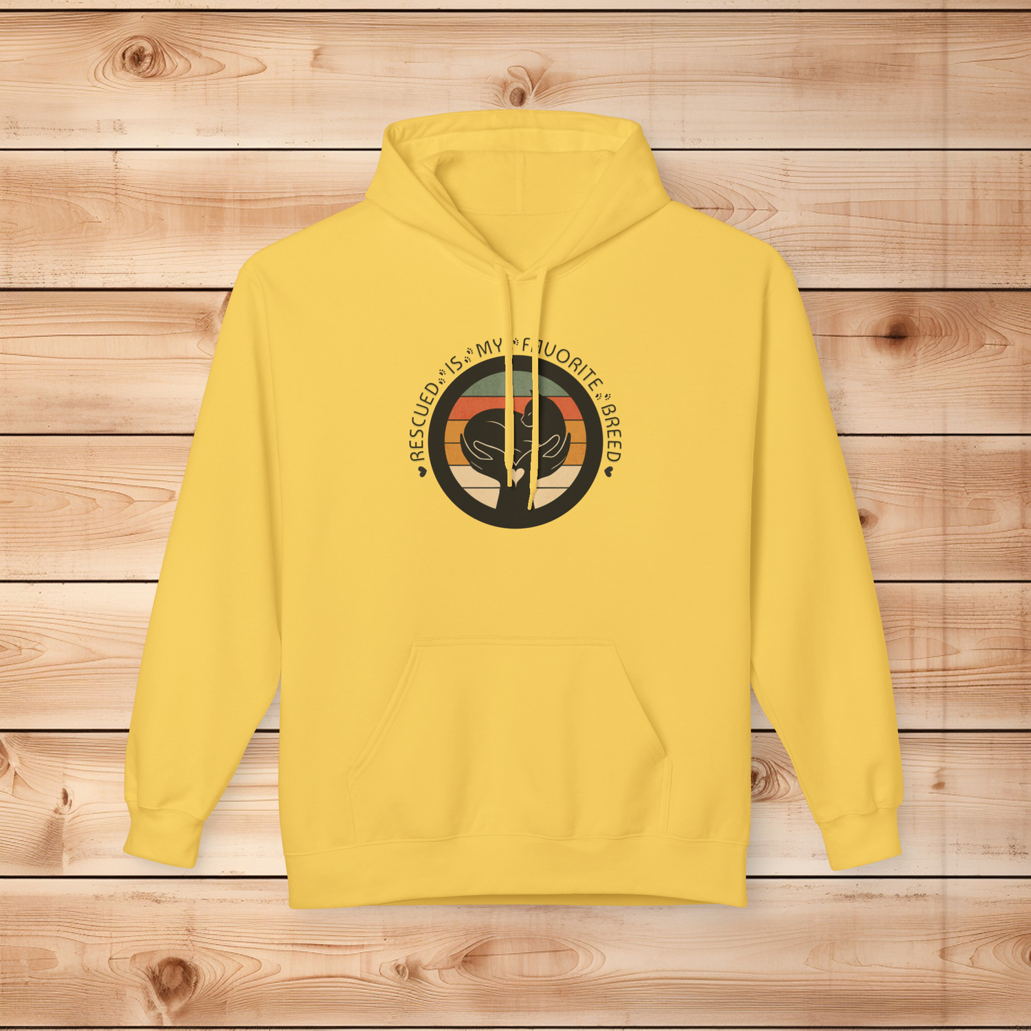 Daisy yellow Gildan SF500 hoodie with Rescued Is My Favorite Breed cat rescue design on a wooden background