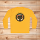 Gold Sport-Tek long sleeve shirt with text saying "Rescued Is My Favorite Breed," with a black and white graphic on a wooden background