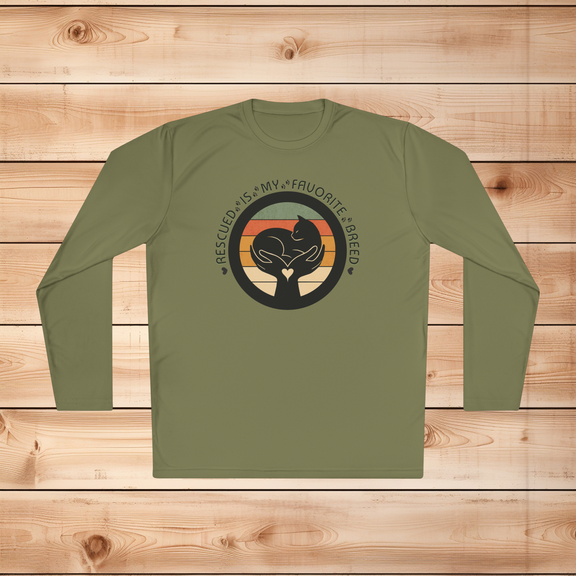 Olive Drab Green Sport-Tek long sleeve shirt with text saying "Rescued Is My Favorite Breed," with a black and white graphic on a wooden background