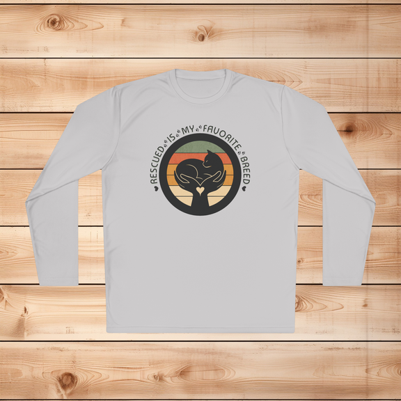 Silver Sport-Tek long sleeve shirt with text saying "Rescued Is My Favorite Breed," with a black and white graphic on a wooden background