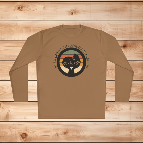 Woodland brown Sport-Tek long sleeve shirt with text saying "Rescued Is My Favorite Breed," with a black and white graphic on a wooden background