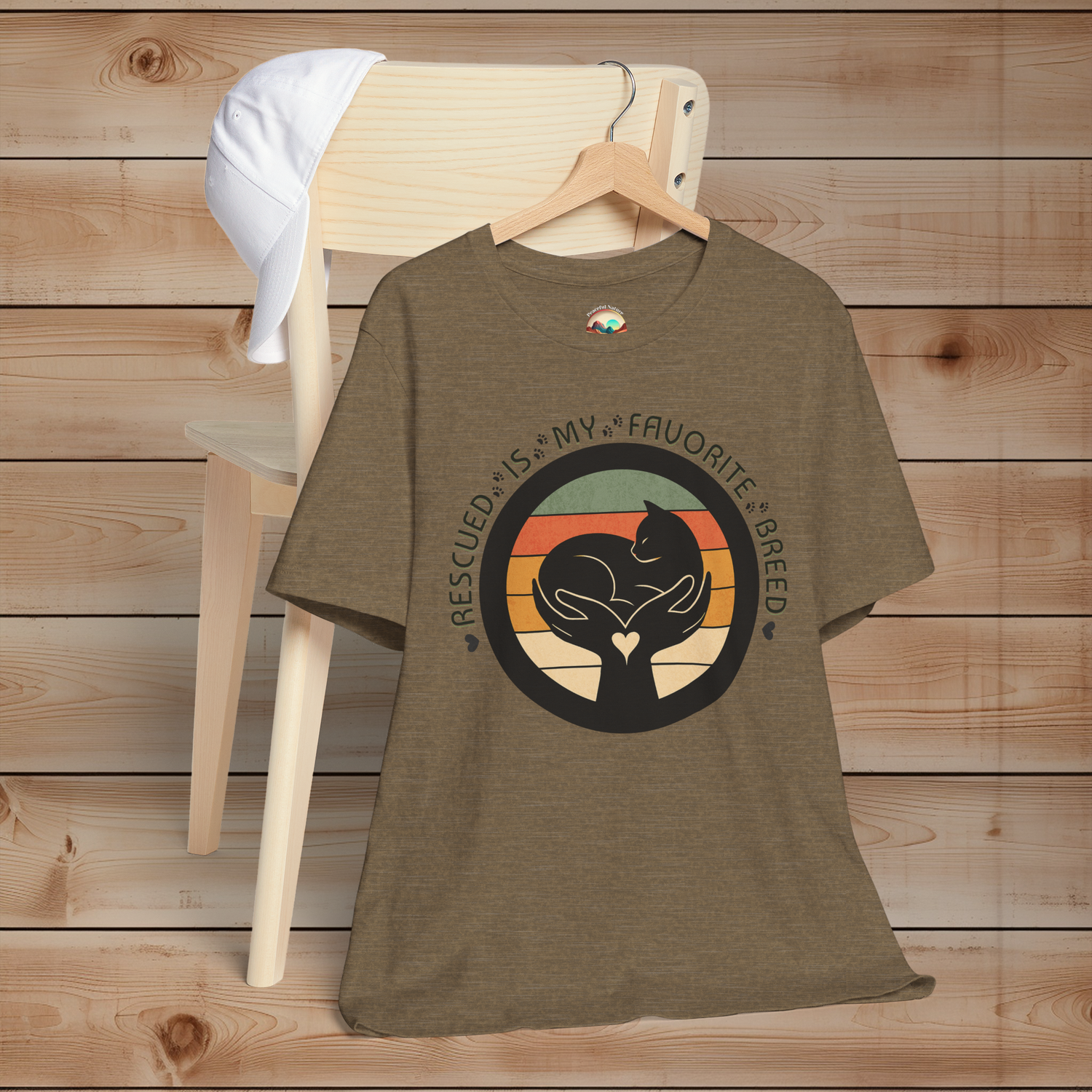 Heather Olive cat rescue T-shirt – ‘Rescued Is My Favorite Breed’ retro design with circular sunset stripes and silhouette cat