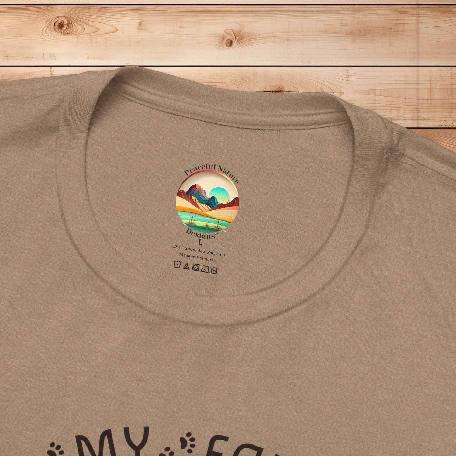 Close-up of Rescued Is My Favorite Breed T-Shirt collar with Peaceful Nature Designs interior label on Bella+Canvas 3001 fabric