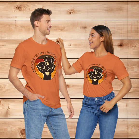 Couple wearing Rescued Is My Favorite Breed T-Shirts in Burnt Orange – Retro Dog Adoption Shirts from Peaceful Nature Designs