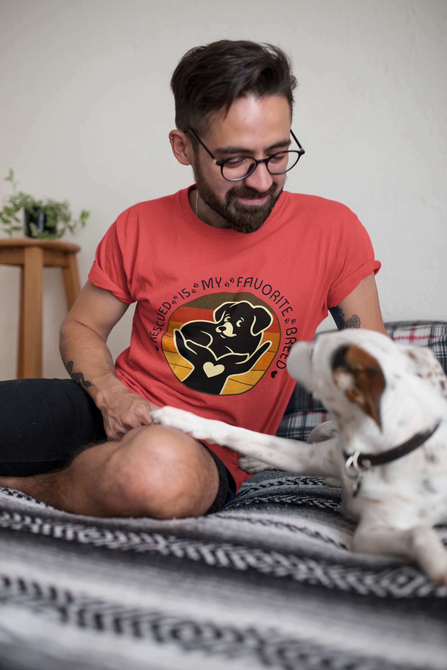 Man wearing Rescued Is My Favorite Breed T-Shirt in Heather Red smiling at his rescue dog – Vintage Animal Rescue Shirt by Peaceful Nature Designs