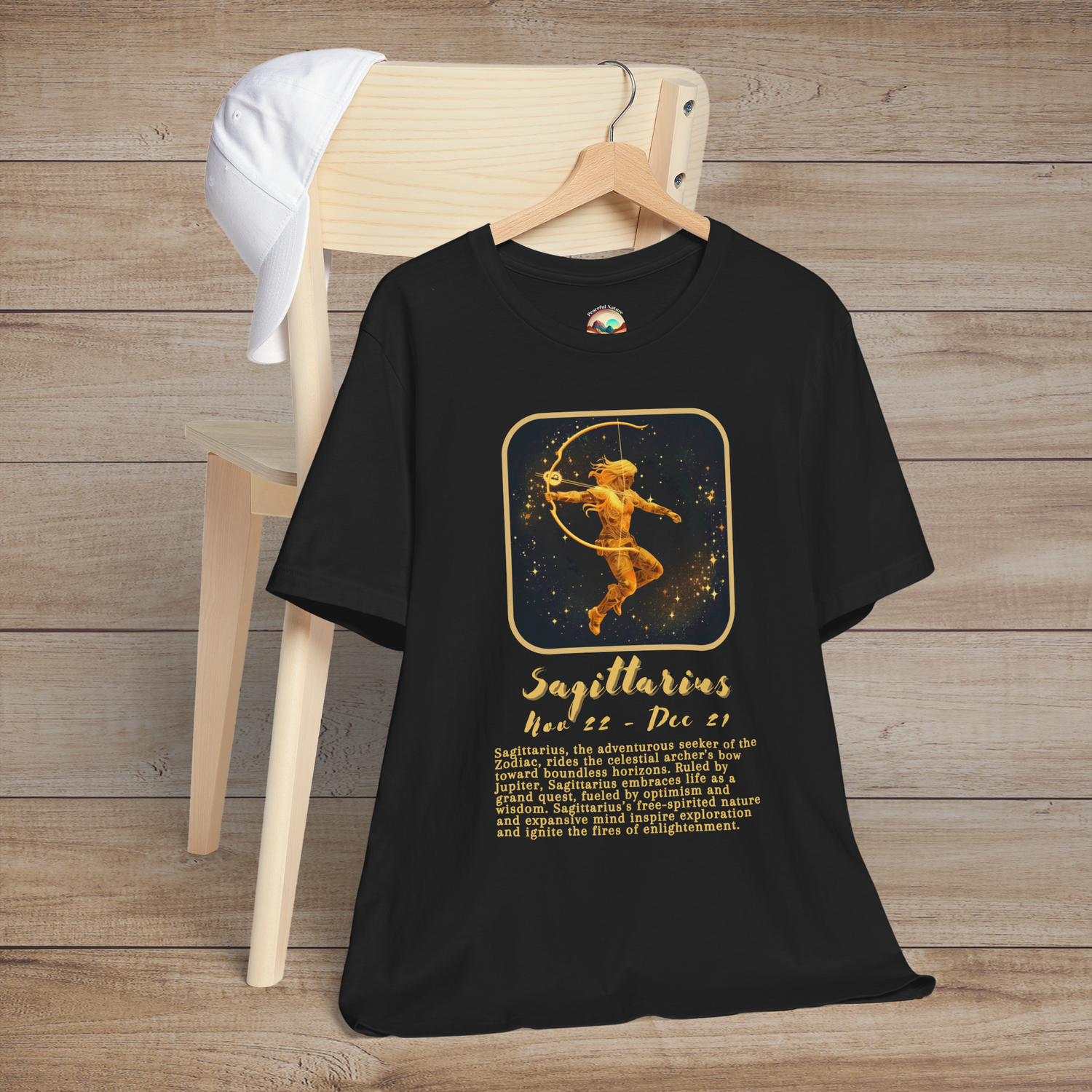 Black Sagittarius Zodiac T-Shirt with a gold archer symbol, birth dates, and traits of freedom and adventure