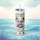 Front view of the Salty Bitch Social Club skinny tumbler in glitter lilac, featuring a lounging skeleton in a pink flamingo float, palm trees, and beachy vibes