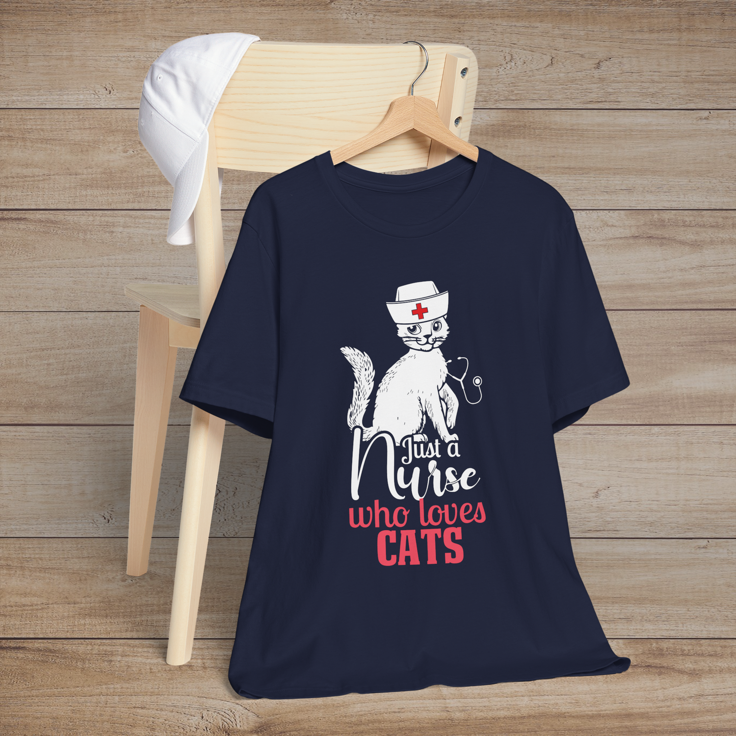 Navy blue t-shirt displaying a cute white cat nurse illustration with the text Just a Nurse Who Loves Cats