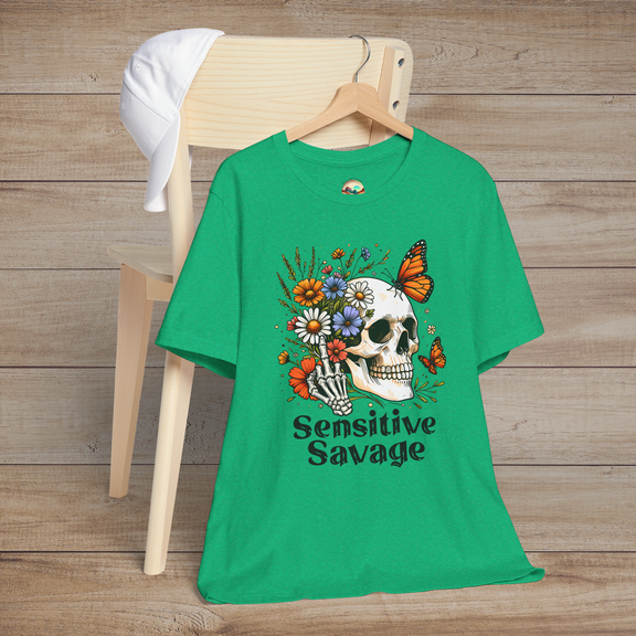 Heather kelly green t-shirt with a boho-gothic style skull, colorful flowers, orange butterflies, and Sensitive Savage text